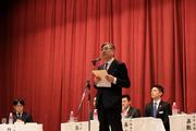 第2部で主催者挨拶を述べる田本健一副学長.jpg